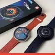 Slim round business smartwatches with leather straps in a presentation box