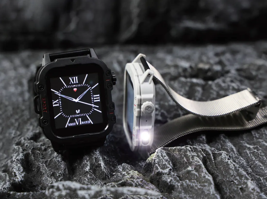 Rugged square smartwatches with a built-in flashlight resting on dark rock
